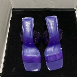 Call it Spring purple heeled sandals with soft clear straps